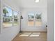 Bright room boasting two large windows and wood floors, with views of a fenced backyard and quiet street at 3000 19Th S Ave, St Petersburg, FL 33712