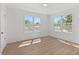 Bright bedroom with wood flooring featuring two large windows that provide great light at 3000 19Th S Ave, St Petersburg, FL 33712