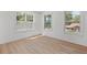 Inviting bedroom features light wood floors and ample natural light from large windows at 3000 19Th S Ave, St Petersburg, FL 33712