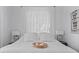 Cozy bedroom decor, highlighted by a plush bed, bedside tables, and natural light filtering through the window at 3000 19Th S Ave, St Petersburg, FL 33712