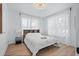Well-lit bedroom featuring a comfortable bed, wood floors, and ample natural light from the window at 3000 19Th S Ave, St Petersburg, FL 33712
