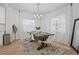 Elegant dining room with a chandelier, large windows, and a spacious layout for entertaining at 3000 19Th S Ave, St Petersburg, FL 33712