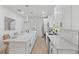 Bright kitchen with white cabinets, stainless steel appliances, and a spacious island with seating at 3000 19Th S Ave, St Petersburg, FL 33712