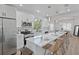 Well-equipped kitchen with stainless steel appliances, quartz countertops, and island seating at 3000 19Th S Ave, St Petersburg, FL 33712