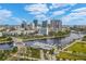 Sweeping aerial cityscape view featuring waterfront condos, modern architecture, and a mix of urban buildings against a sunny sky at 312 N Manhattan Ave, Tampa, FL 33609