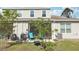 Backyard view featuring a patio, landscaping, and shade trees, perfect for outdoor enjoyment at 3158 Victoria Inlet Dr, Holiday, FL 34691