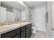Bathroom featuring double sinks, granite countertops, and decorative finishes at 3158 Victoria Inlet Dr, Holiday, FL 34691