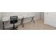 Bedroom area with a black desk and a carpeted floor at 3158 Victoria Inlet Dr, Holiday, FL 34691