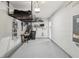 Functional garage with sealed floors, overhead storage, and ample space for vehicles or storage at 3158 Victoria Inlet Dr, Holiday, FL 34691