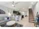 Open concept living room, kitchen, and staircase at 3158 Victoria Inlet Dr, Holiday, FL 34691