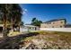 Backyard space with shed, bordering neighboring homes at 3216 W Paxton Ave, Tampa, FL 33611