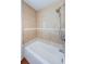 Bathroom shower and tub featuring tan tiling at 3216 W Paxton Ave, Tampa, FL 33611