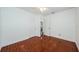 Bright bedroom with white walls, ceiling fan, and brown tile flooring for easy maintenance at 3216 W Paxton Ave, Tampa, FL 33611