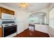 Charming kitchen showcasing bright light and a breakfast bar to the living room at 3216 W Paxton Ave, Tampa, FL 33611