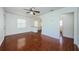 Bright living room featuring a ceiling fan and shiny tile flooring at 3216 W Paxton Ave, Tampa, FL 33611
