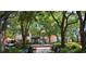 Charming town center featuring a fountain surrounded by lush landscaping and shops at 3216 W Paxton Ave, Tampa, FL 33611