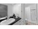 Bathroom with white cabinets and vanity at 3407 W Busch Blvd, Tampa, FL 33618