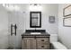 Bathroom featuring a shower, modern vanity with drawers and toilet at 3407 W Busch Blvd, Tampa, FL 33618
