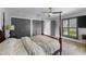 Primary bedroom with ceiling fan and multiple doors at 3407 W Busch Blvd, Tampa, FL 33618