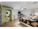 Bright bedroom featuring a bed, wardrobe closet, desk, tv, and a ceiling fan at 3407 W Busch Blvd, Tampa, FL 33618