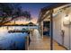 Picturesque boat dock with a covered area, offering stunning sunset views over the tranquil lake at 3407 W Busch Blvd, Tampa, FL 33618