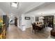 Open-concept dining room features hardwood floors, elegant furnishings, and modern lighting at 3407 W Busch Blvd, Tampa, FL 33618