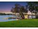 Private boat dock on a calm lake with jet skis and boat parked at 3407 W Busch Blvd, Tampa, FL 33618