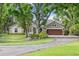 Charming home with a private pond, lush landscaping, and a two-car garage at 3407 W Busch Blvd, Tampa, FL 33618