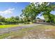 Home with a private pond, and a two-car garage at 3407 W Busch Blvd, Tampa, FL 33618