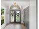 Grand foyer with a decorative front door and arched transom window at 3407 W Busch Blvd, Tampa, FL 33618