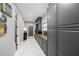 Hallway featuring built-in storage and decor, with a view of a sports themed room at 3407 W Busch Blvd, Tampa, FL 33618