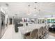 Open kitchen with a large center island, stainless steel appliances, and access to the living area at 3407 W Busch Blvd, Tampa, FL 33618