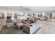 Spacious living room that opens up to the kitchen and dining area in an open concept at 3407 W Busch Blvd, Tampa, FL 33618