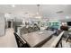 Open floor plan showcases the kitchen, dining area, and living room with outdoor views at 3407 W Busch Blvd, Tampa, FL 33618