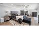 Comfortable main bedroom with sitting area, wood floors, and gray color palette at 3407 W Busch Blvd, Tampa, FL 33618