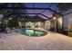 Beautiful screened-in pool area with patio and access to the home's interior, ideal for entertaining at 3407 W Busch Blvd, Tampa, FL 33618