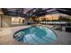 Sparkling swimming pool with a screened enclosure and patio area, perfect for relaxation and entertaining at 3407 W Busch Blvd, Tampa, FL 33618