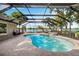 Screened pool with mature trees and waterfront views at 3407 W Busch Blvd, Tampa, FL 33618