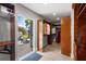 Spacious walk-in closet with wooden organizers and walk-out door to backyard deck and lake at 3407 W Busch Blvd, Tampa, FL 33618