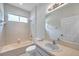 White bathroom with tub, shower, toilet, and vanity at 3527 101St E Ave, Parrish, FL 34219
