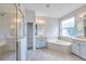Bright bathroom featuring soaking tub, walk-in shower, dual vanity and lots of natural light at 3527 101St E Ave, Parrish, FL 34219