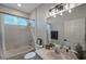 Bathroom with tub/shower combo and window at 3527 101St E Ave, Parrish, FL 34219
