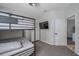 Bedroom featuring a bunk bed and flat screen TV at 3527 101St E Ave, Parrish, FL 34219