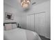 This bedroom has a queen bed, a closet, and a piece of modern art on the wall at 3527 101St E Ave, Parrish, FL 34219