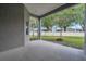 Covered patio providing view of green backyard and privacy fence at 3527 101St E Ave, Parrish, FL 34219