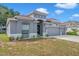 Well-kept one-story home with three-car garage and neatly landscaped front yard, ready for new owners at 3527 101St E Ave, Parrish, FL 34219