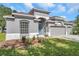Charming single-Gathering home with a three-car garage and landscaped front yard at 3527 101St E Ave, Parrish, FL 34219