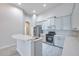 This spacious kitchen features stainless steel appliances, and white cabinetry at 3527 101St E Ave, Parrish, FL 34219