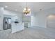 This spacious kitchen features stainless steel appliances, and white cabinetry at 3527 101St E Ave, Parrish, FL 34219