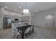 Modern kitchen with a dining area, stainless steel appliances and sleek countertops at 3527 101St E Ave, Parrish, FL 34219